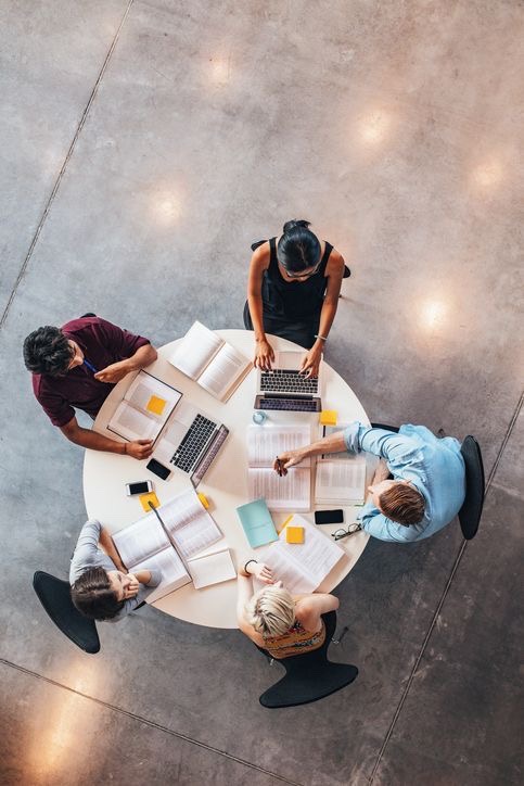 Students collaborating at a round table